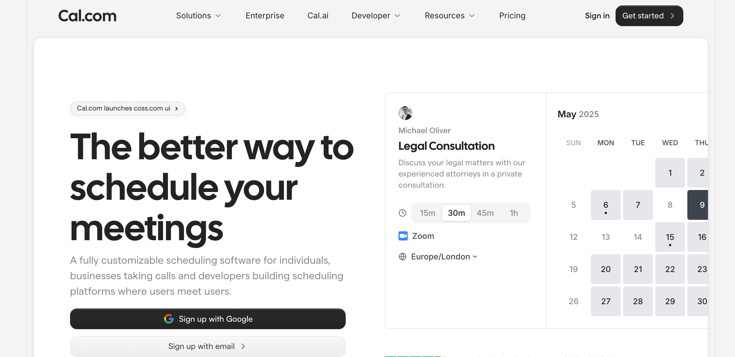 Cal.com homepage displaying the headline 'The better way to schedule your meetings' with descriptive text about customizable scheduling software. The left side shows sign-up options including a black 'Sign up with Google' button and a 'Sign up with email' button. The right side features a booking interface preview showing a Legal Consultation appointment with Michael Oliver, duration options (15m, 30m, 45m, 1h), Zoom as the meeting platform, Europe/London timezone, and a May 2025 calendar with selectable dates.