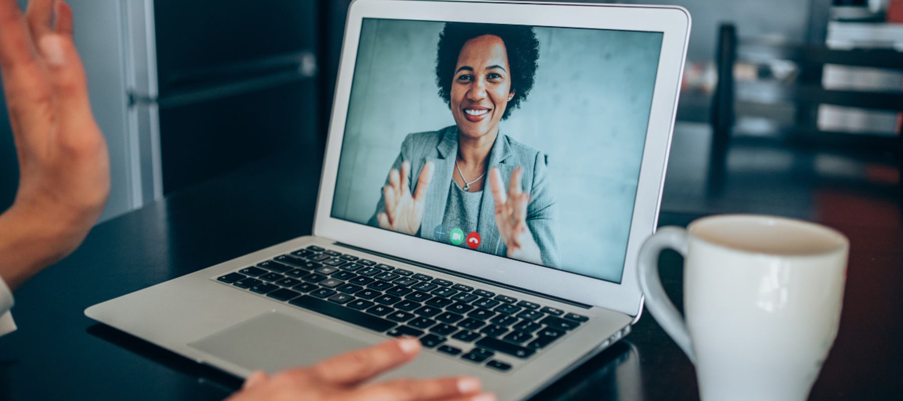 Woman on video call, talking to viewer.